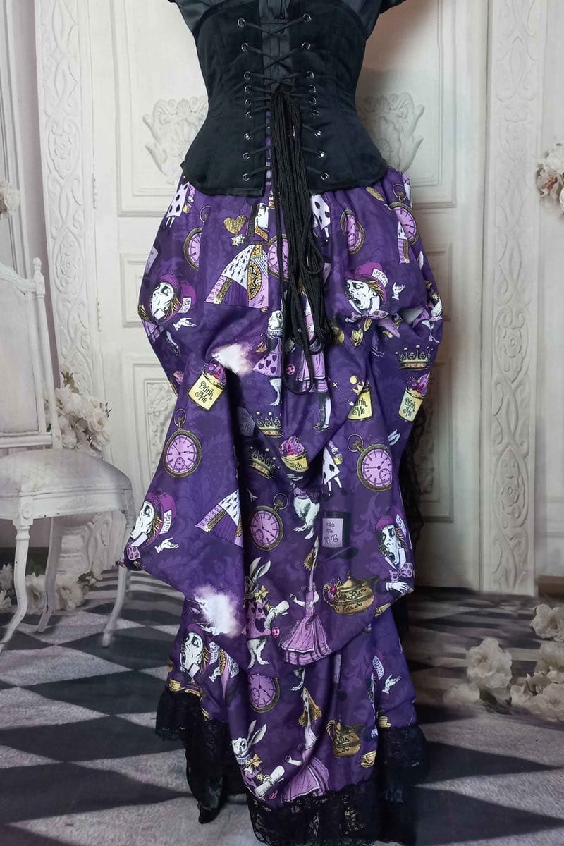 back view of the victorian bustle high low skirt made from custom designed purple alice in wonderland fabric