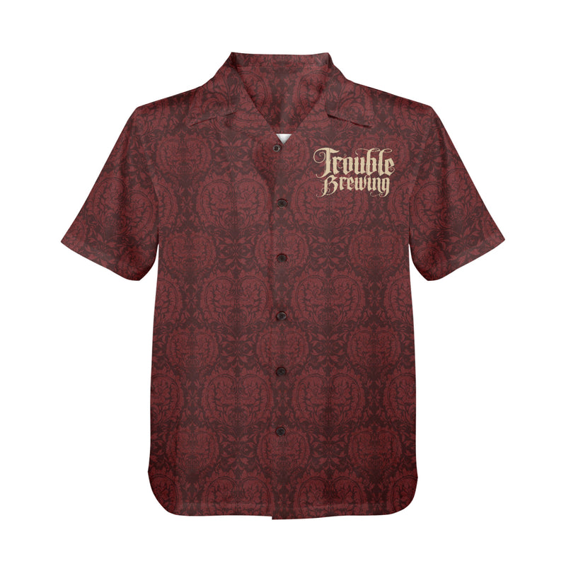 Red patterned shirt with 'Trouble Brewing' text on a white background