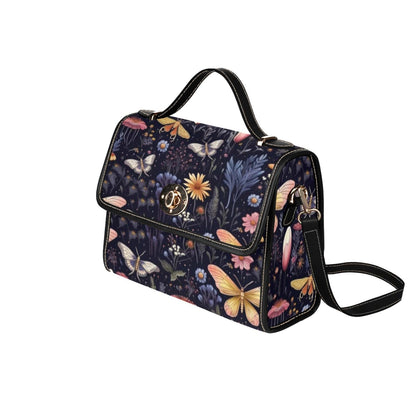 side view of the Stylish boxy satchel handbag featuring vintage style cottagecore midnight garden print featuring beautiful moths and dark florals
