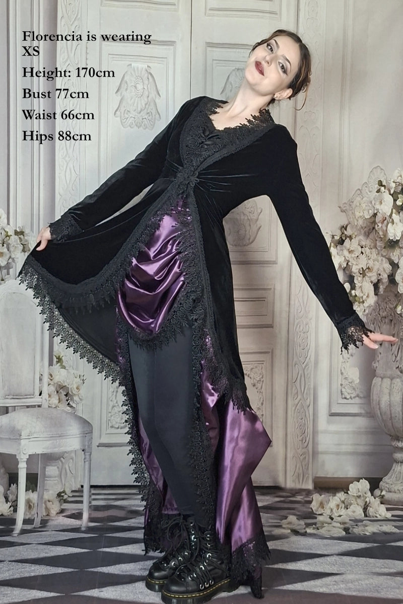 Woman wearing a black velvet coat and purple dress with lace trim details in an elegant room. Image overlaid with measurements