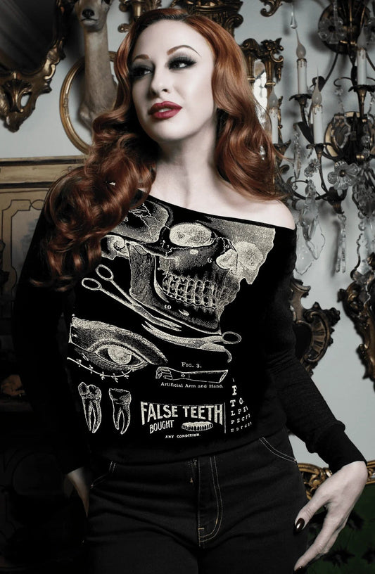 gothic alternative model wearing the raw edge off the shoulder sweatshirt featuring a vintage x-ray screen print of victorian medical malpractice chart from Se7en Deadly, made in the USA, available at Gallery Serpentine