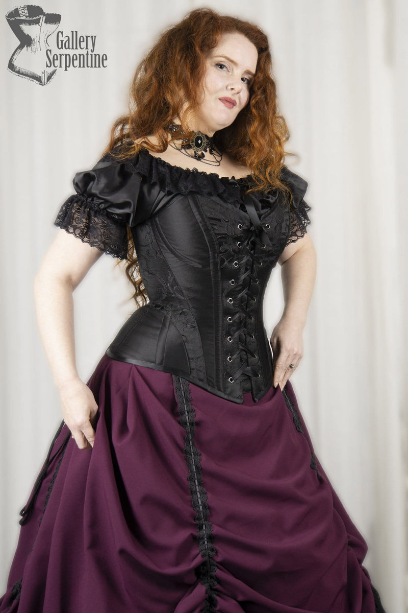 side view of model wearing the new black front lacing steel boned corset from Australia