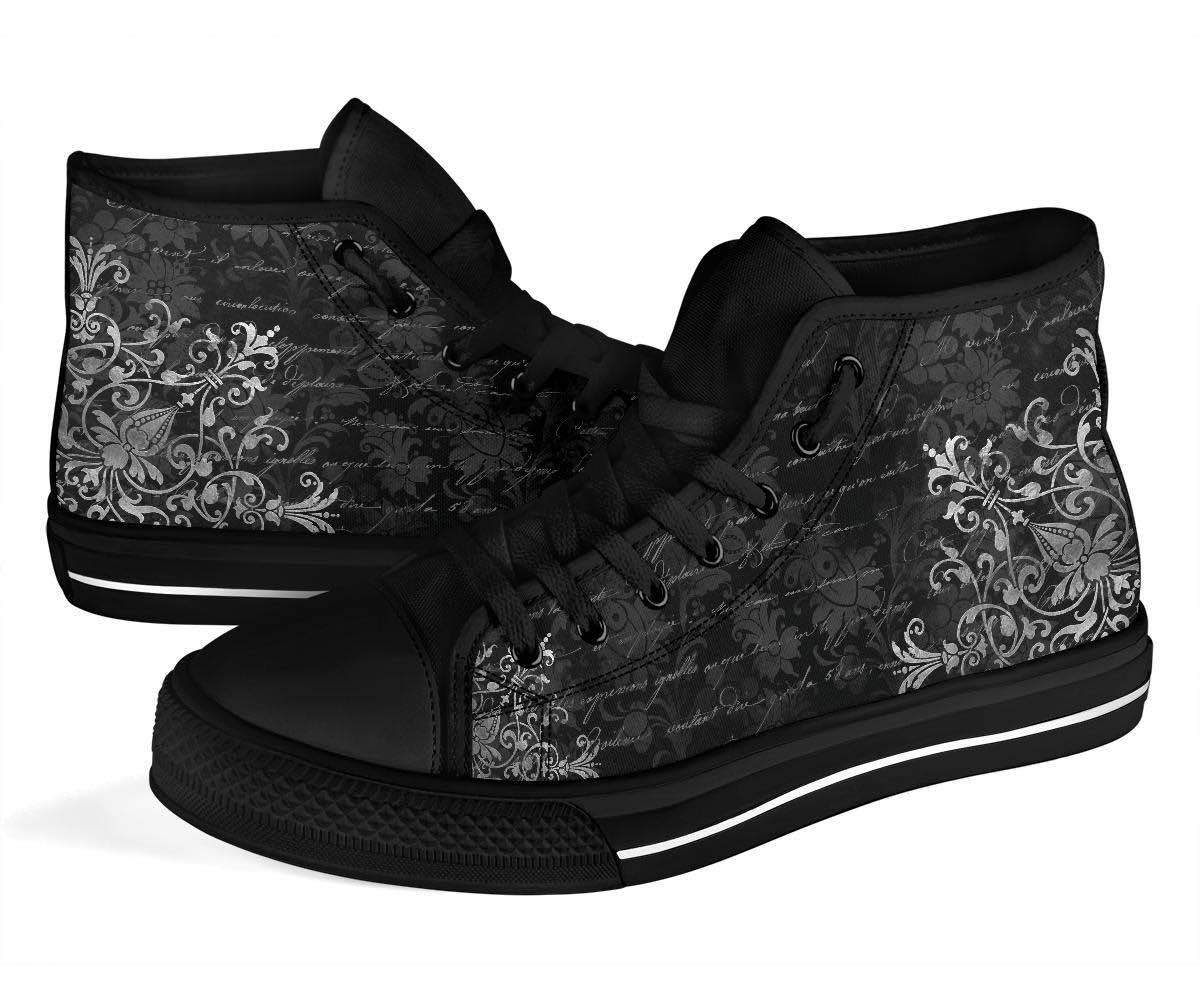 close up on the baroque print and gothic ghost writing on the gothic ghost writer womens high top sneakers