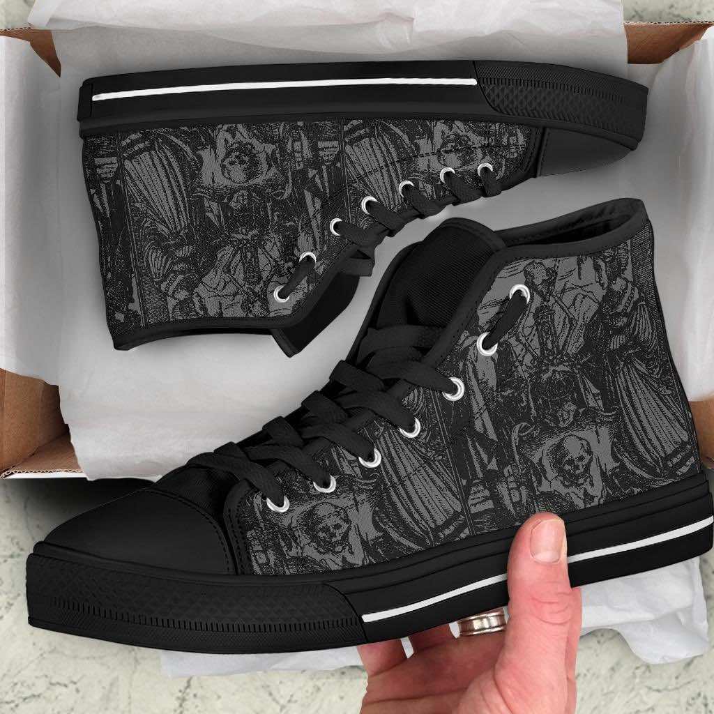 man receiving the men's grey black high top canvas sneakers with Holbein woodcut Dance of Death as a gothic Christmas present
