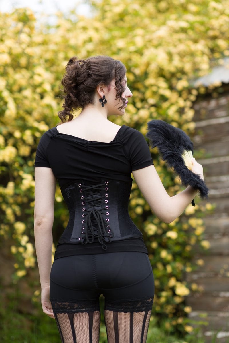 gothic victorian lingerie model in fajas shape wear and Gallery Serpentine lace under bust corset showing the back view of lacing and eyelets