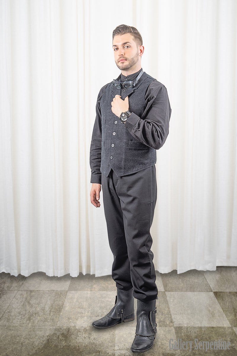 full length pose showing the Tombstone trousers worn with a classic Frontier Engineer vest, black Timeless Victorian shirt, retro silver goggles and gators