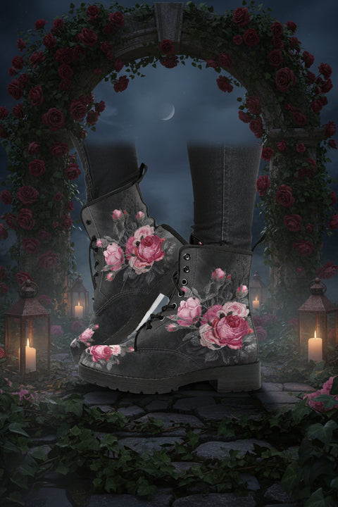 A pair of vegan women's boots with a grey base color featuring a large pink rose print, rounded toe, and lace-up front.