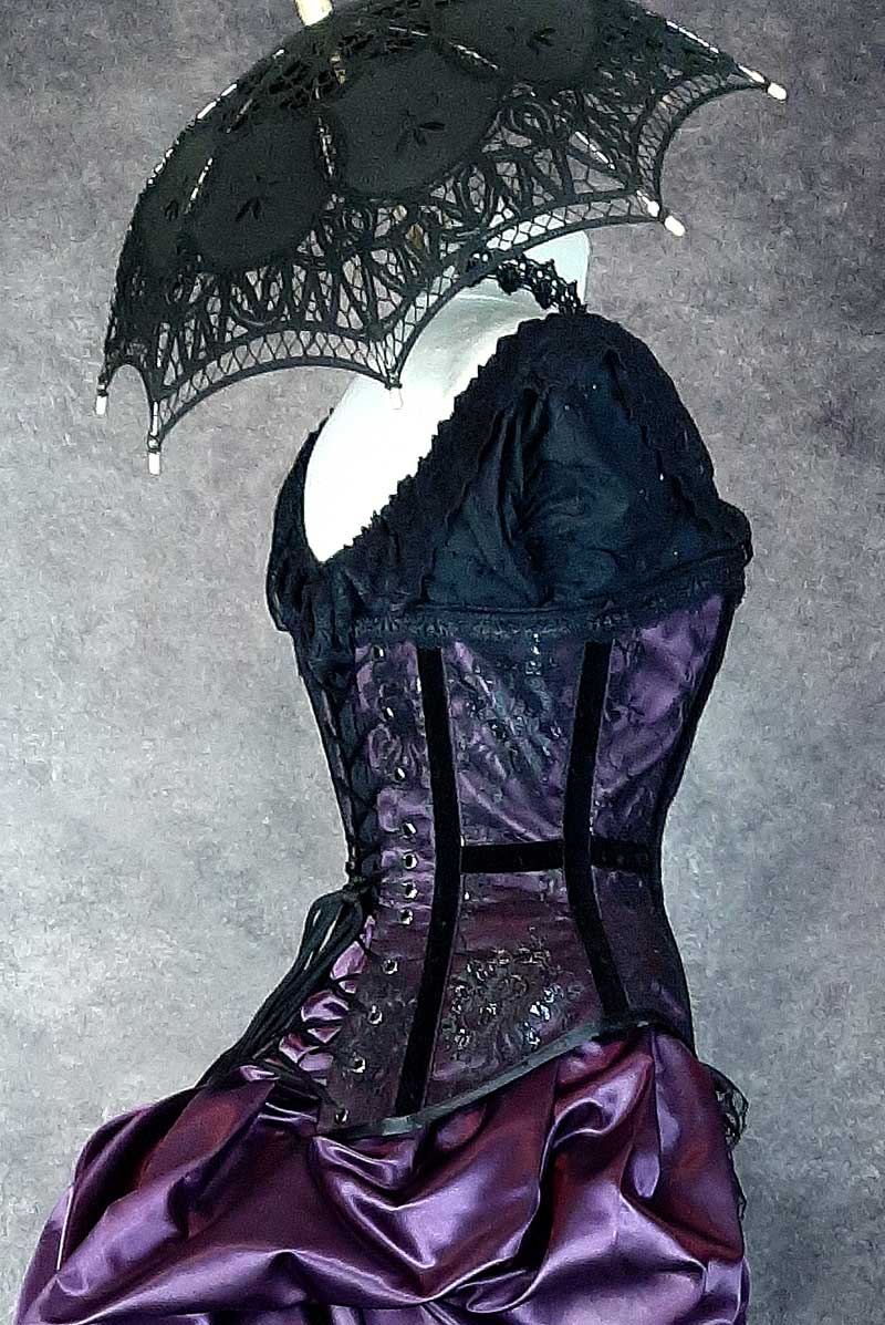 close up of the back lacing and black velvet ribbon detailing on the Pandora Amethyst over bust corset made in Australia