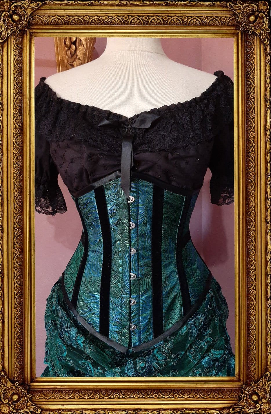 front view of the peacock brocade under bust victorian corset trimmed with black velvet