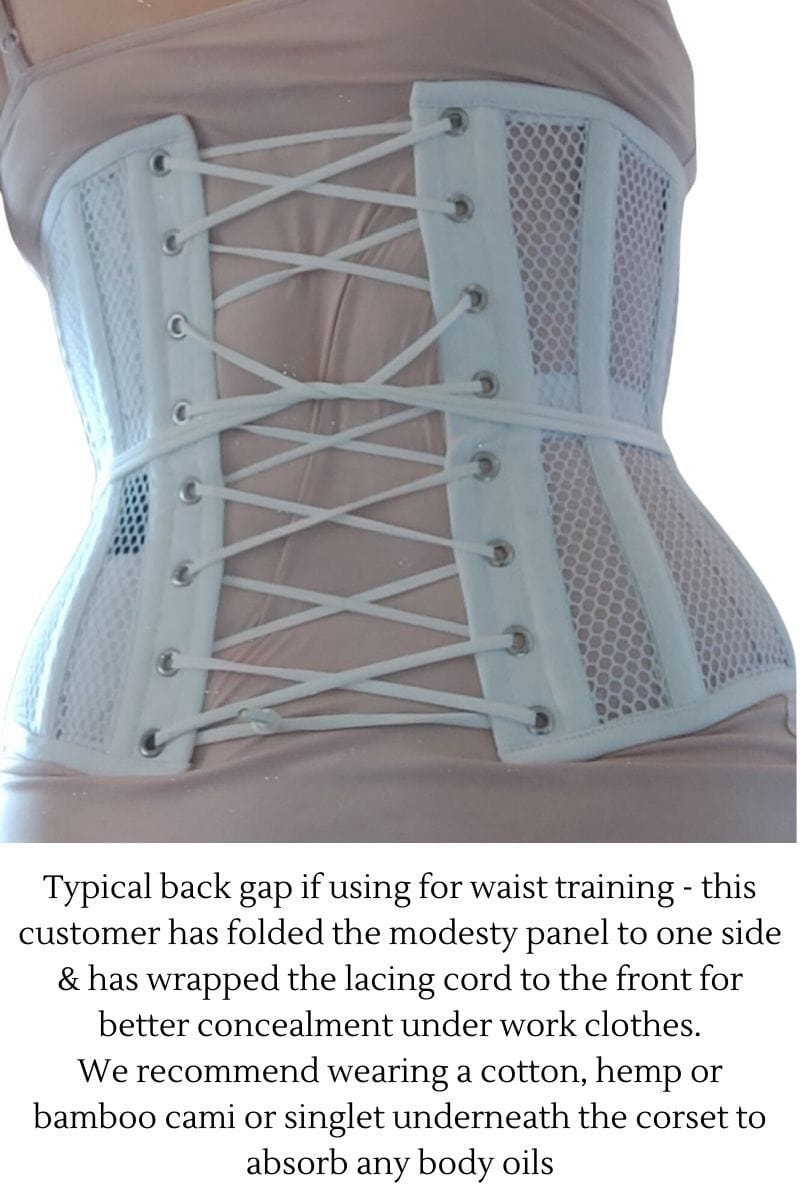 waist training corset customer of Gallery Serpentine showing the gap at back of her Undercover Angel white mesh corset, text under photo describes the typical gap and gives care tips for the corset