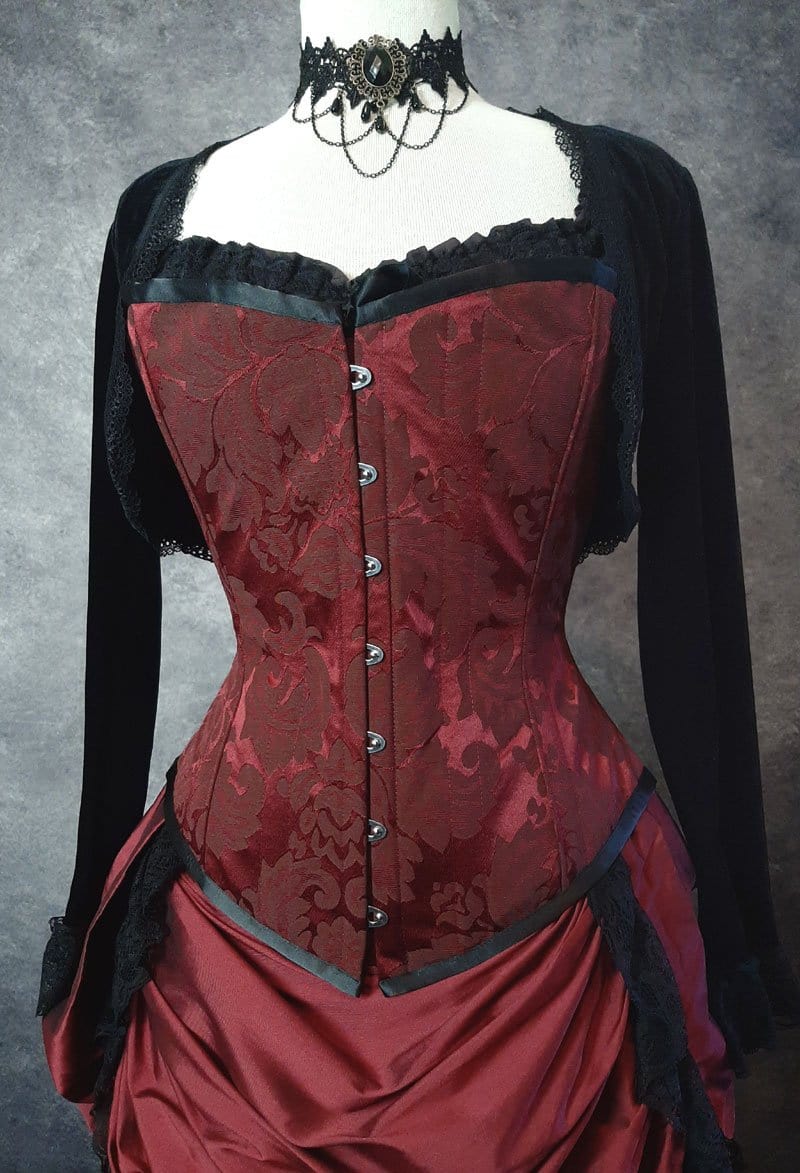 close up on the front of the garnet brocade over bust steel boned corset made in Australia