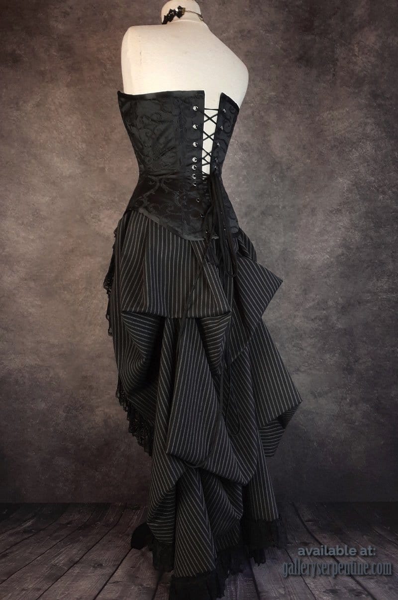 side back view of the Venus corset on a mannequin showing corset lacing and drapes in the back of the bustle skirt