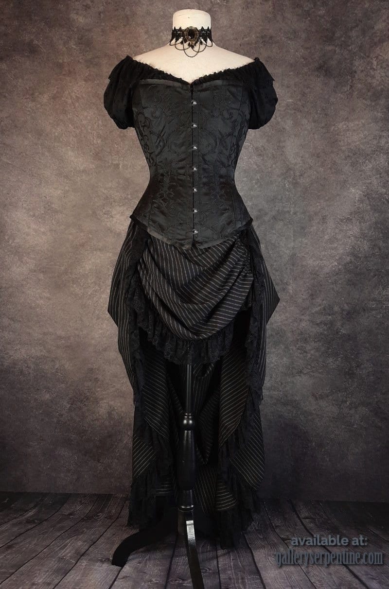 full front view of the Venus black brocade over bust corset worn with a chemise underneath it in black broderie anglaise