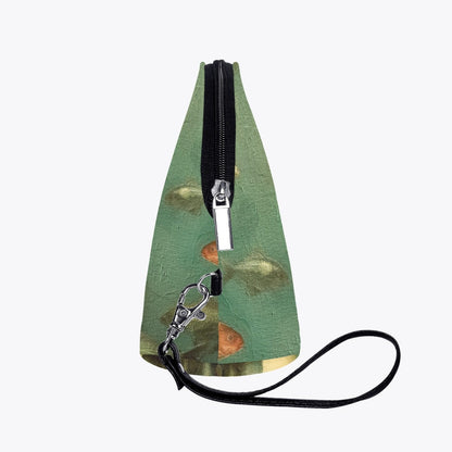side view of the oil painting style makeup purse ideal as a gift for travellers who appreciate the mysteries of the ocean and mermaids, colour palette of sage and sea greens, reds, creams