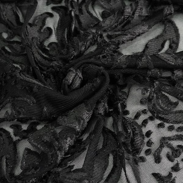 close up on the fabric of the black velvet flocked mesh full length witch elegant gothic hooded cloak at Gallery Serpentine