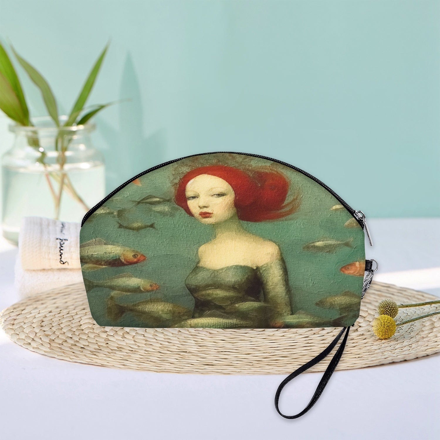 oil painting style makeup purse ideal as a gift for travellers who appreciate the mysteries of the ocean and mermaids, colour palette of sage and sea greens, reds, creams shown in a bathroom setting