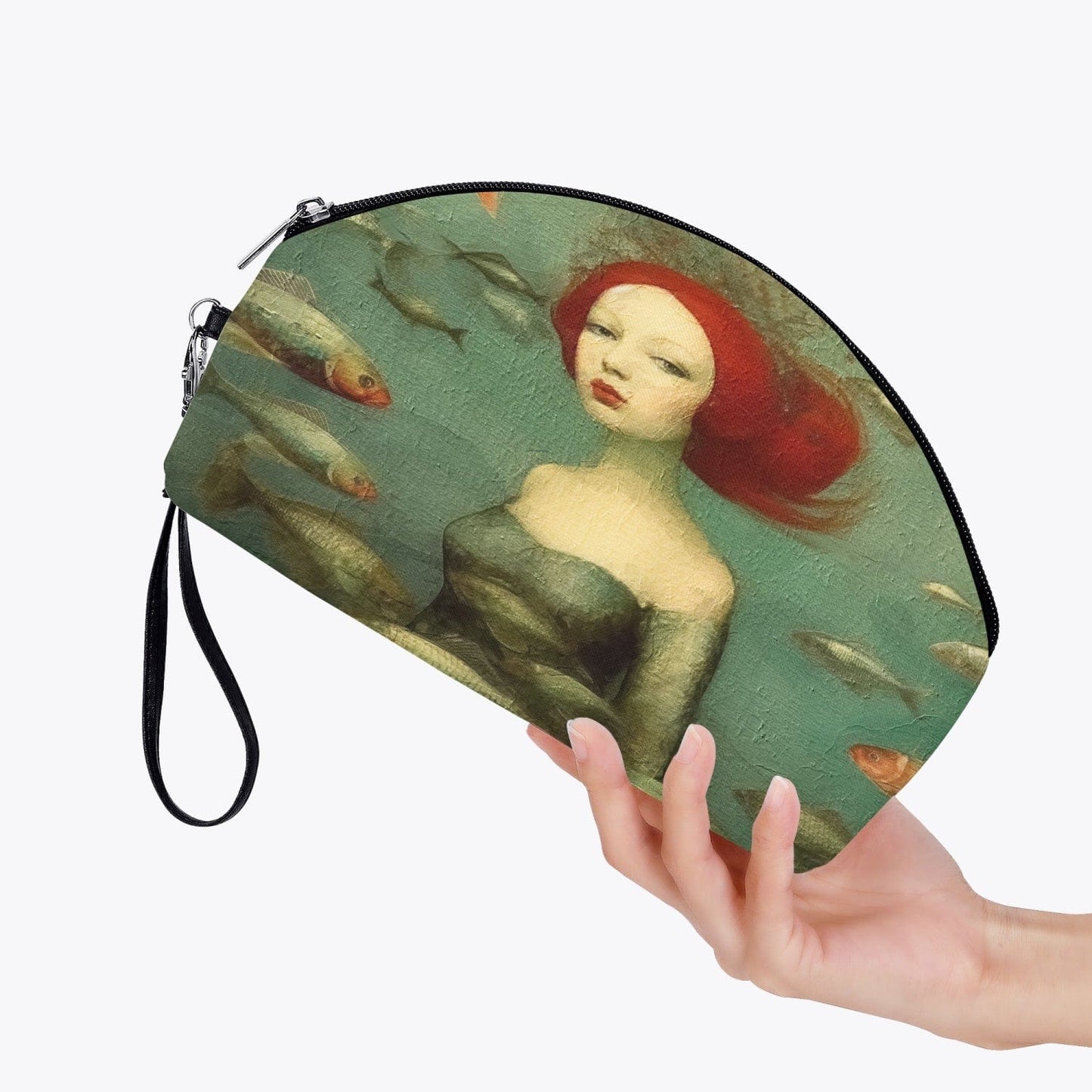 woman's hand holding the oil painting style makeup purse ideal as a gift for travellers who appreciate the mysteries of the ocean and mermaids, colour palette of sage and sea greens, reds, creams