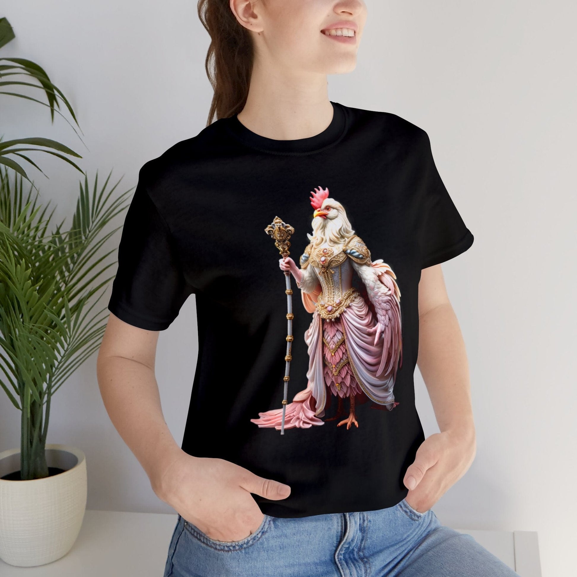 Royal Queen of the Chickens, Queen Cluck in a glorious pink gown on a Bella+Canvas 3001 t-shirt worn by a newly graduated college student