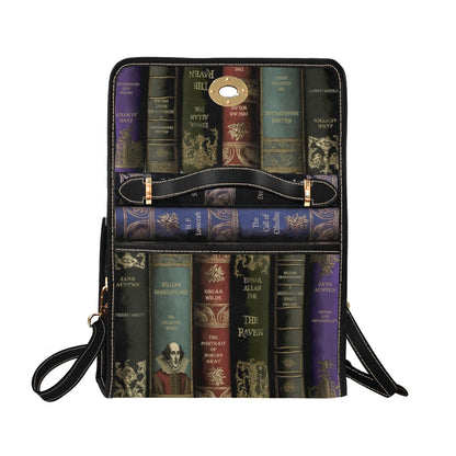 back of the open satchel handbag printed with spines of classic literature titles in dark colours