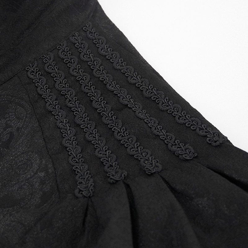 up close on the braid detailing on the archetypal goth clubbing shirt in black embossed paisley with lace at cuffs and rows of black braid across the shoulders, features ornate domed buttons
