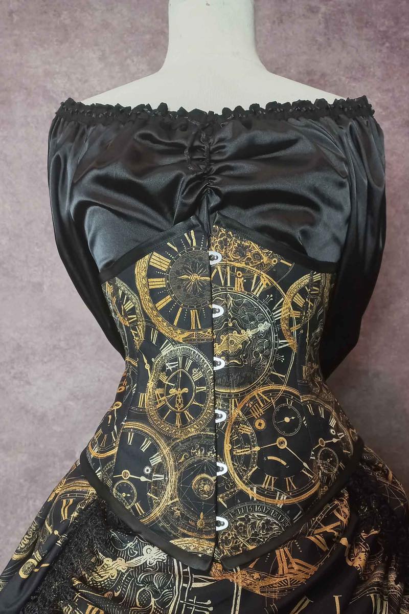 elegant steampunk victorian bustle skirt and corset set from Gallery Serpentine featuring custom made clock fabric, front view of the corset