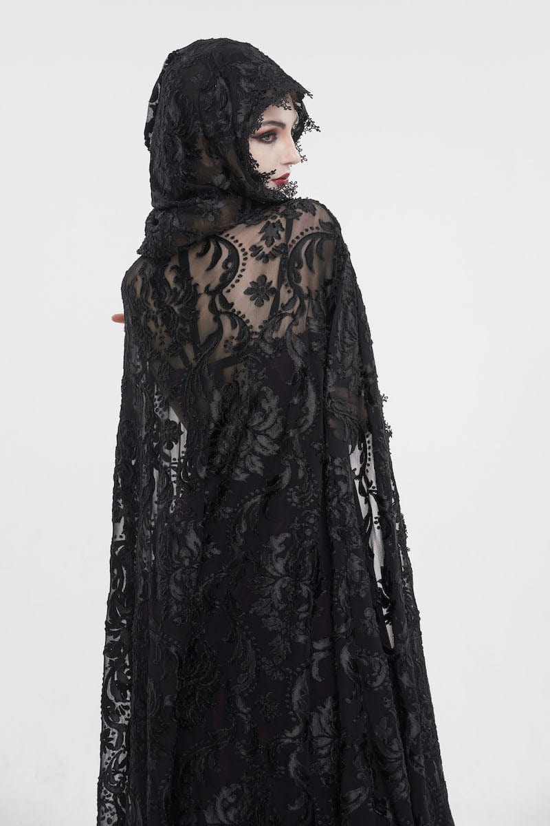 gothic woman looking over her shoulder wearing the black velvet flocked mesh full length witch elegant gothic hooded cloak at Gallery Serpentine