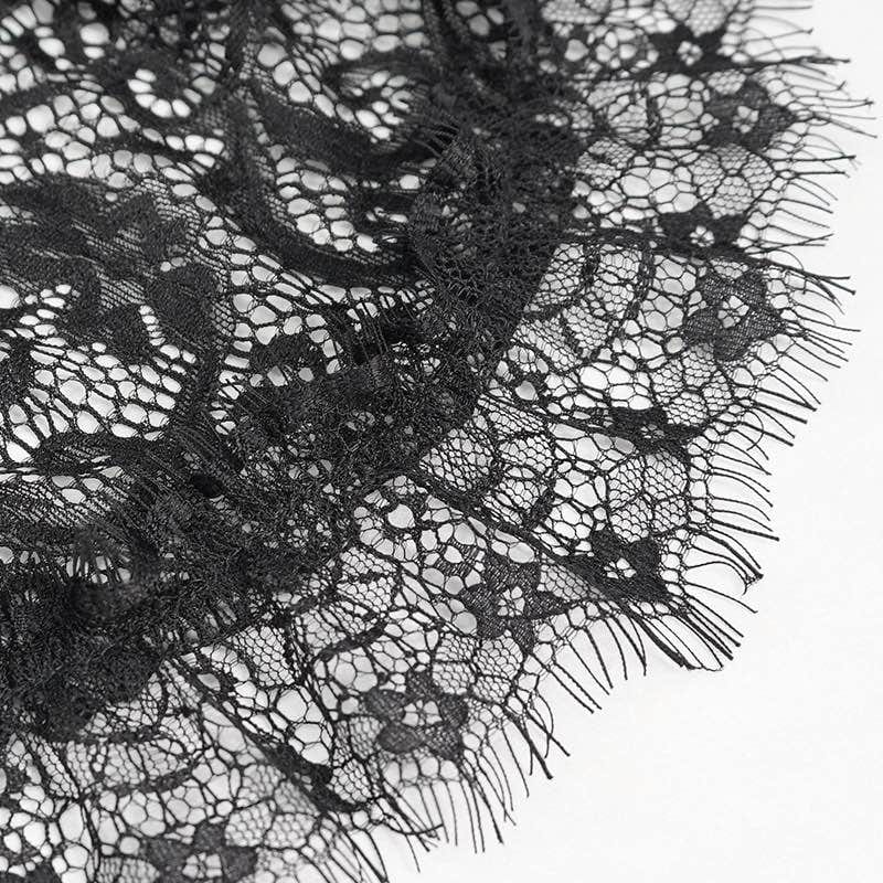 close up on the eyelash lace trim of the top