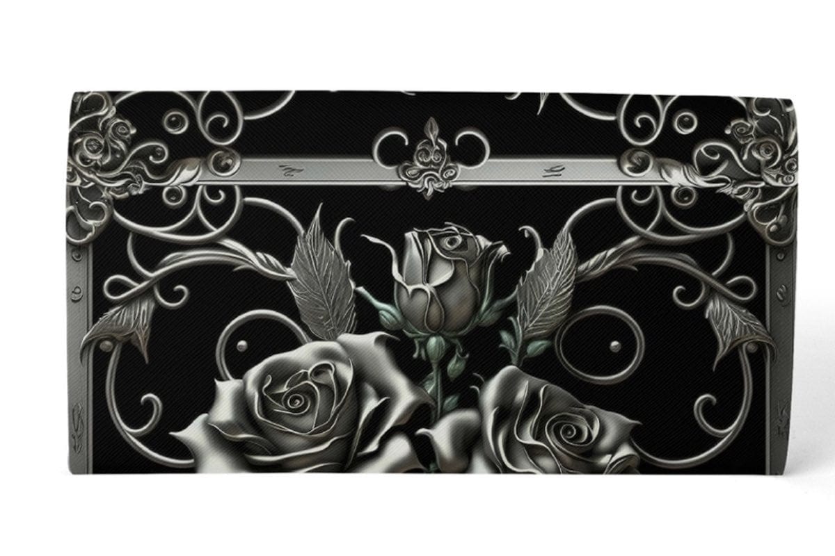 close up on the filigree scrolls and baroque silver roses on the clutch purse
