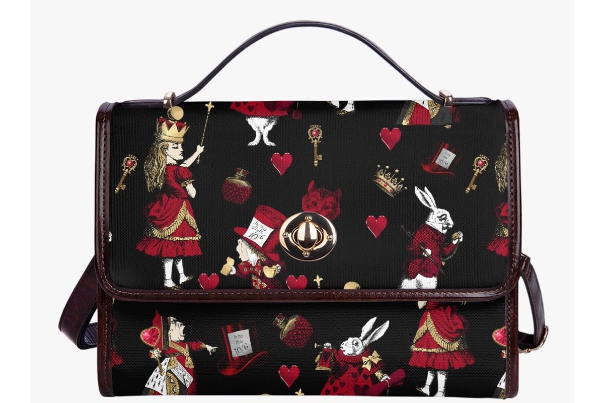 front close up view on the characters on the black red gold alice in wonderland gothic satchel handbag