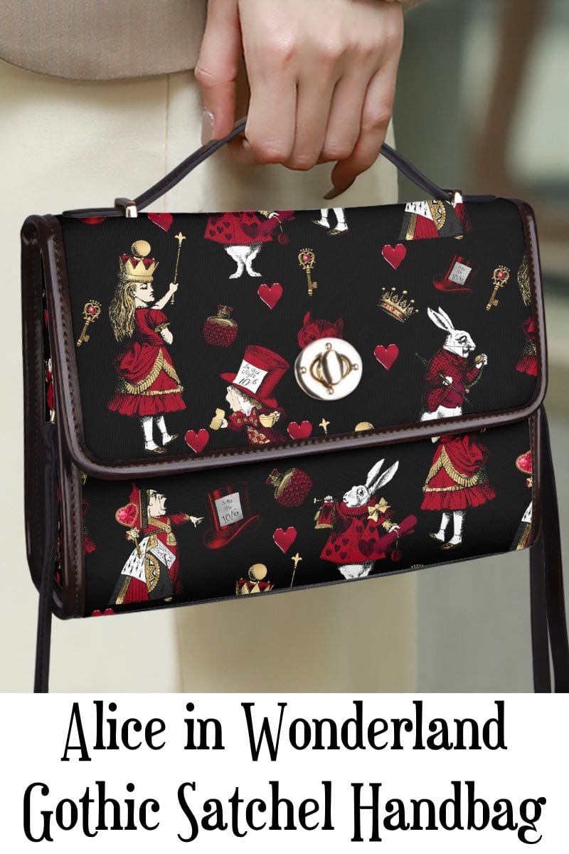 high powered operative carrying the black red gold alice in wonderland gothic satchel handbag