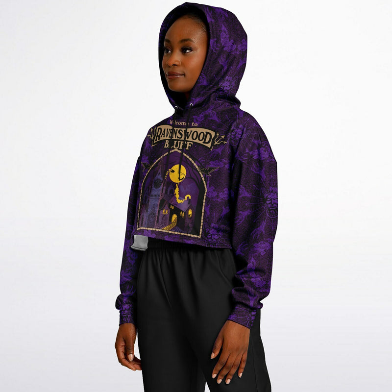cropped short hoodie for Blood on the Clocktower fans featuring a portal view into the mythical setting of the boardgame, Ravenswood Bluff and a Welcome sign 5