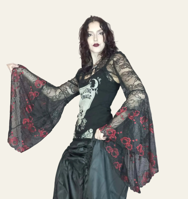 gothic black lace  with red embroidered roses with medieval angel sleeves on a gothic musician