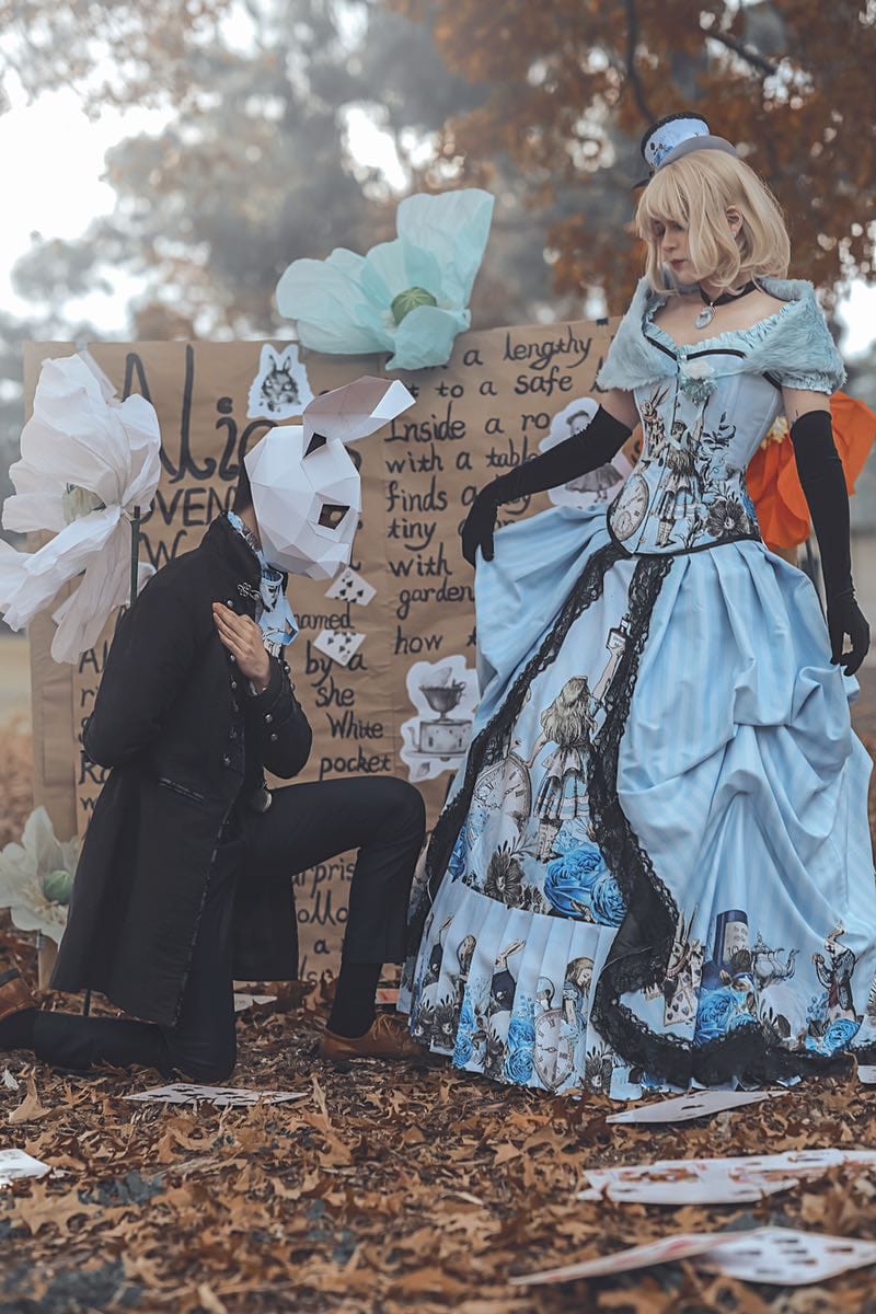 white rabbit kneeling in front of victorian style Alice in Wonderland