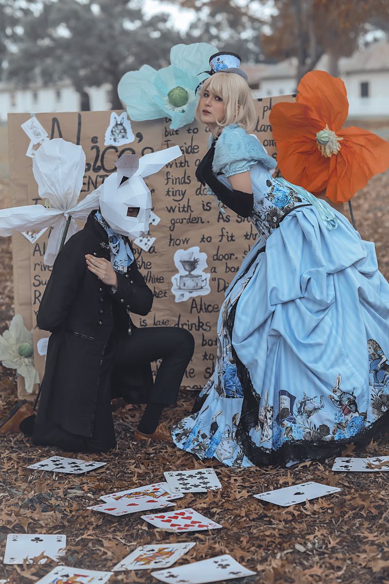 Alice in Wonderland blue corset gown and white rabbit groom in black pirate jacket by Gallery Serpentine