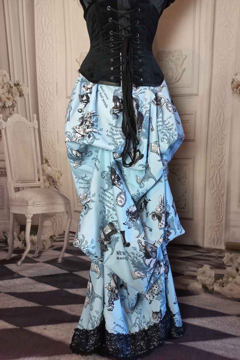 blue Alice in Wonderland victorian high low bustle skirt printed with Alice quotes, the white rabbit, Alice and many of the characters, trimmed in black braid 4