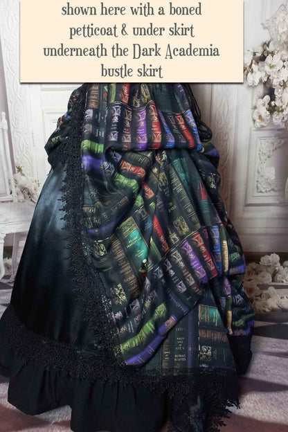 side view of the dark academia gothic victorian bustle skirt made in Australia featuring book spines from Poe Shakespeare Austen worn with a boned petticoat underneath for a fuller silhouette