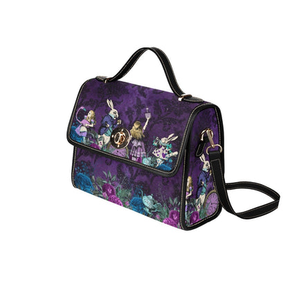 side front view showing the black faux leather strap and handle of the Purple damask background on an Alice in wonderland themed gothic satchel handbag featuring the White Rabbit at Gallery Serpentine