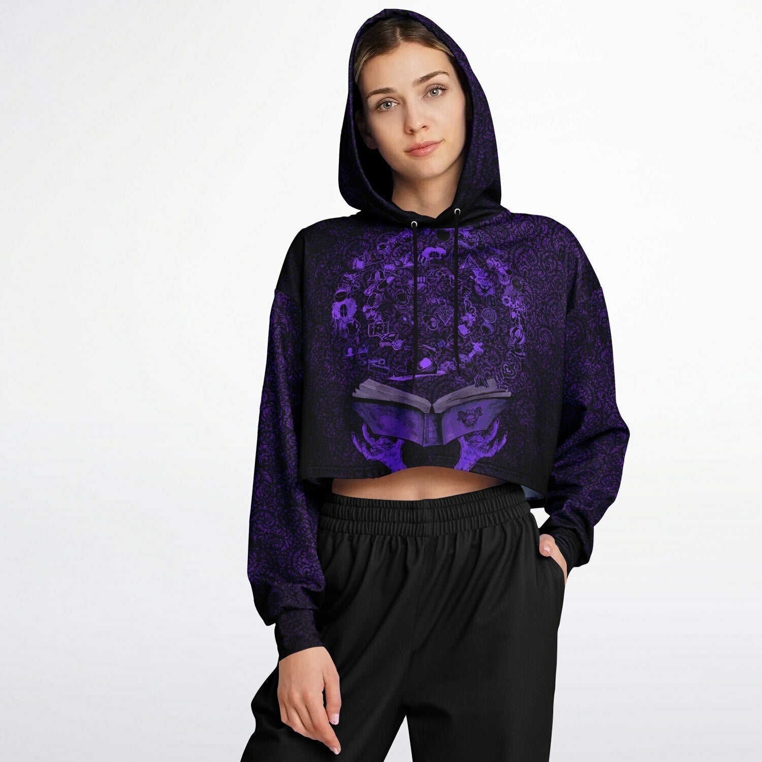 front view on botc fan wearing the cropped short hoodie for Blood on the Clocktower fans featuring the purple and black Grimoire and character tokens