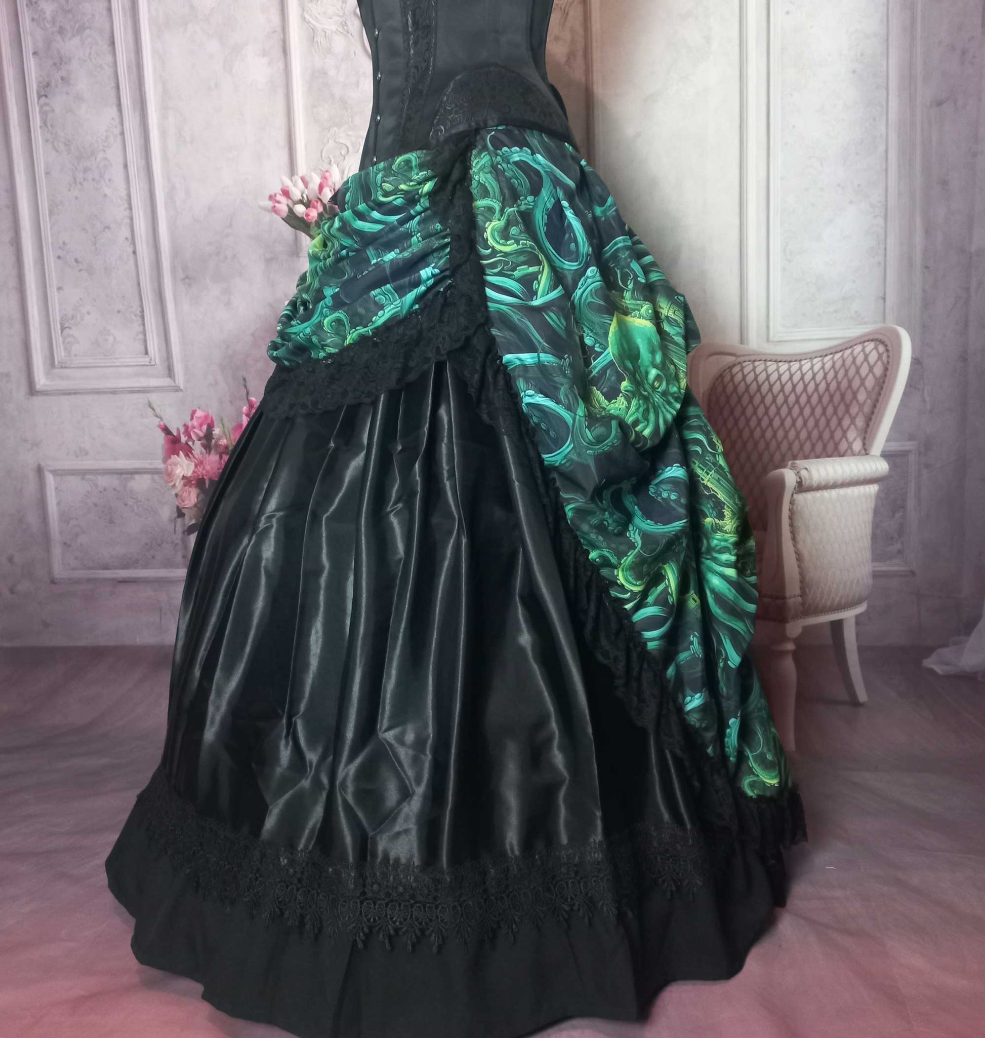 side view of the Call of Cthulhu victorian high low bustle skirt, made to measure in Australia showing the Majestical black petticoat underneath the green of the bustle skirt