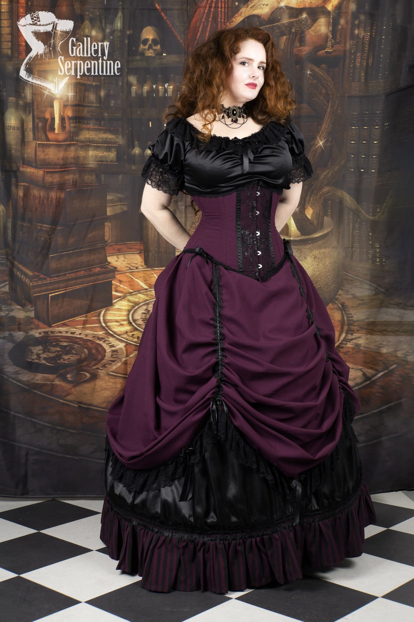model showing the matching under bust victorian corset that goes with the Burgundy Beauty skirt set and boned petticoat