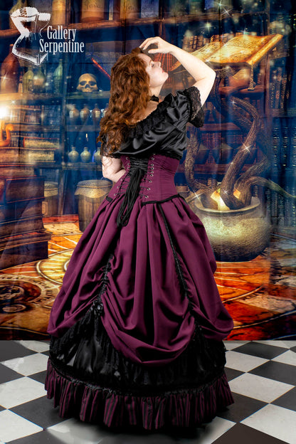 back view of the model showing the matching under bust victorian corset that goes with the Burgundy Beauty skirt set