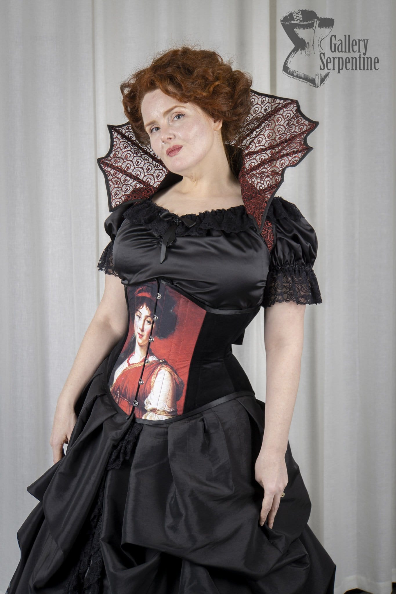 red headed pre raphaelite victorian model wearing a lace elizabethan collar and modelling the new pre raphaelite corset for Gallery Serpentine