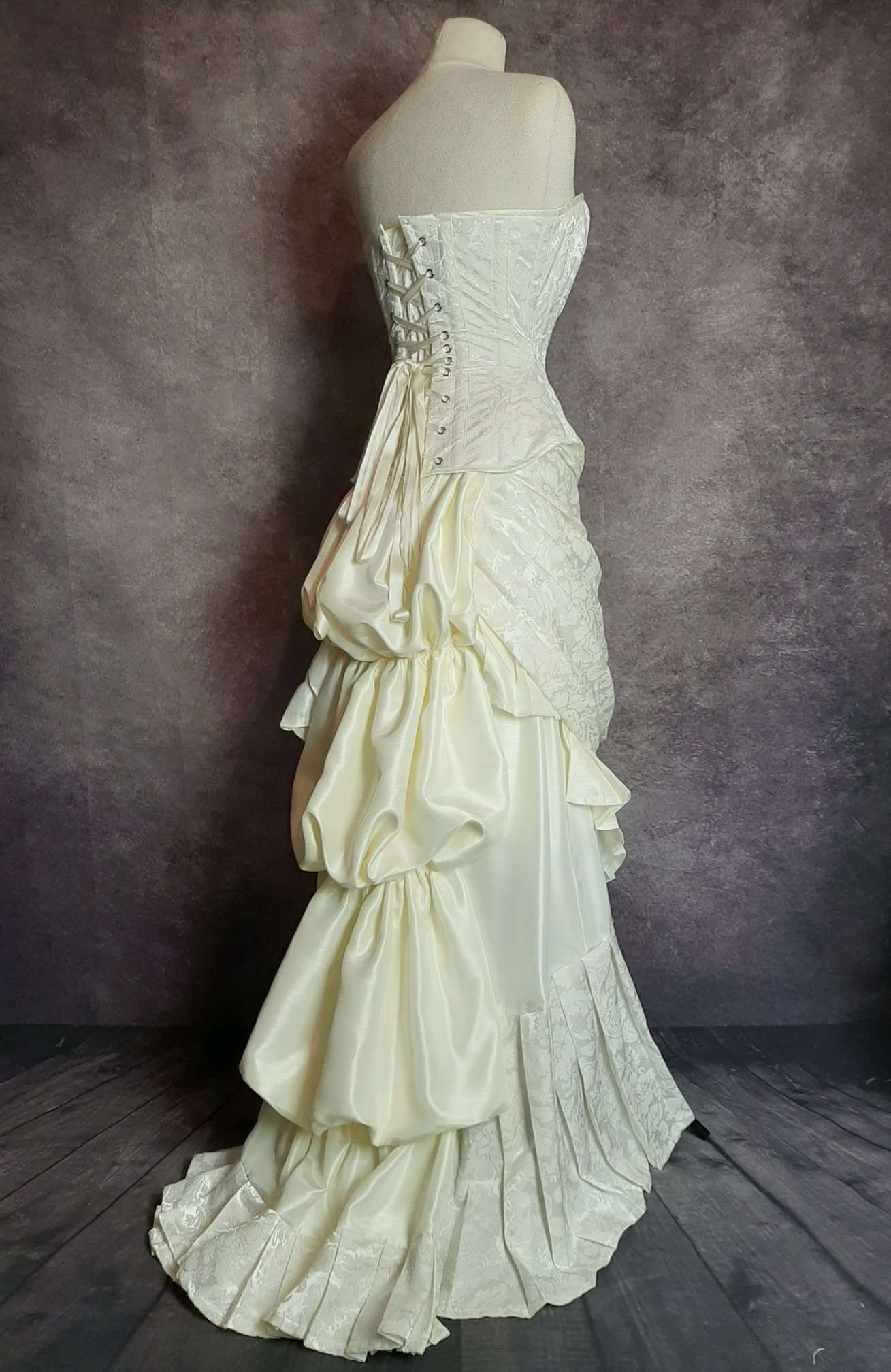 side view of the ivory victorian 1880's inspired wedding corset gown made in Australia by Gallery Serpentine