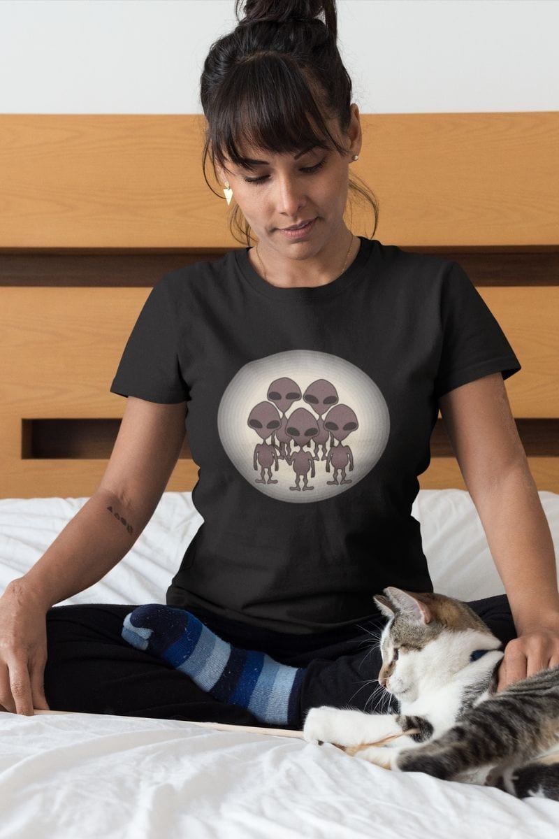 female with cat wearing the We Came to TikTok Alien t-shirt