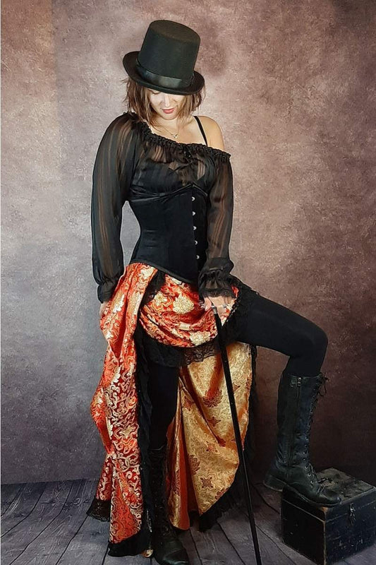 Gothic model wearing a Gallery Serpentine Golden Red high low Victorian Bustle Skirt with a black velvet corset