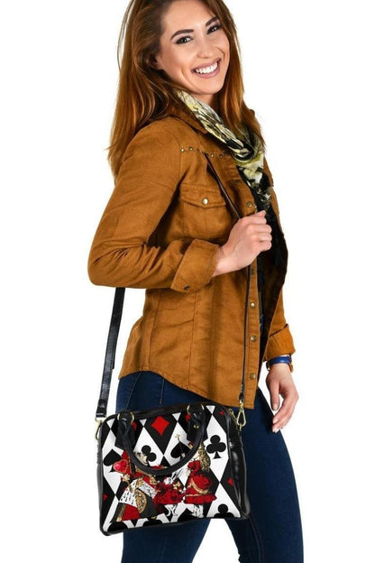 woman carrying the Queen of Hearts Alice in Wonderland handbag using the shoulder strap