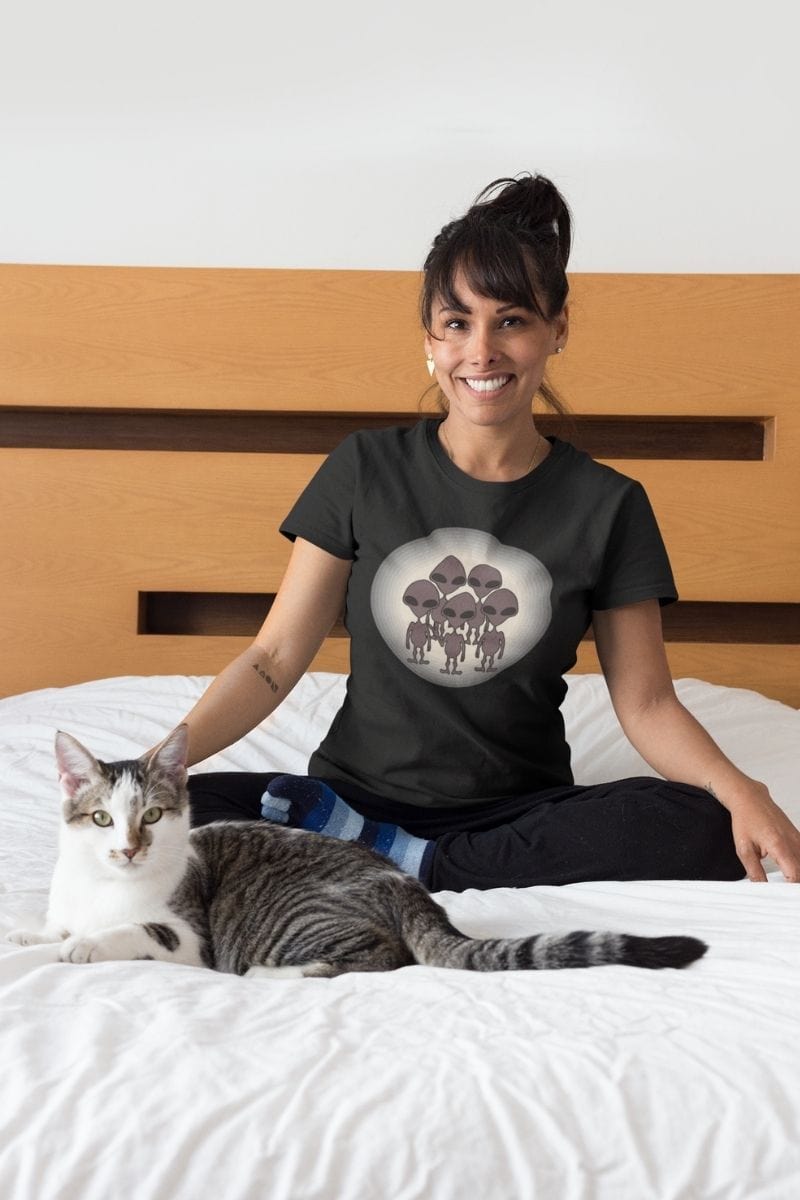 smiling female with cat wearing the We Came to TikTok Alien t-shirt