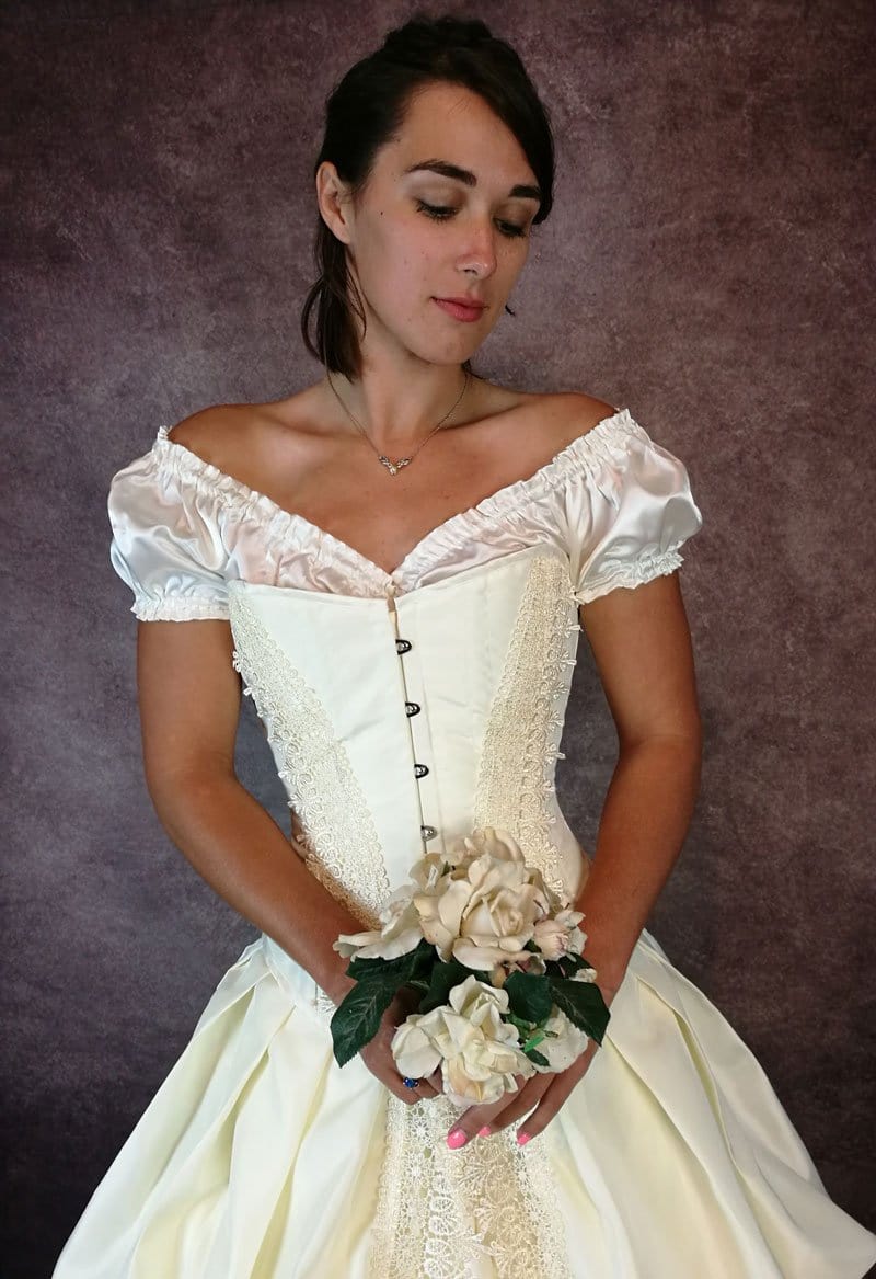 close up front view of a bridal model wearing the victorian Ivory Majestica Wedding Dress by Gallery Serpentine