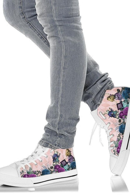 Soft pink Alice in Wonderland high top sneakers worn by a teenage girl