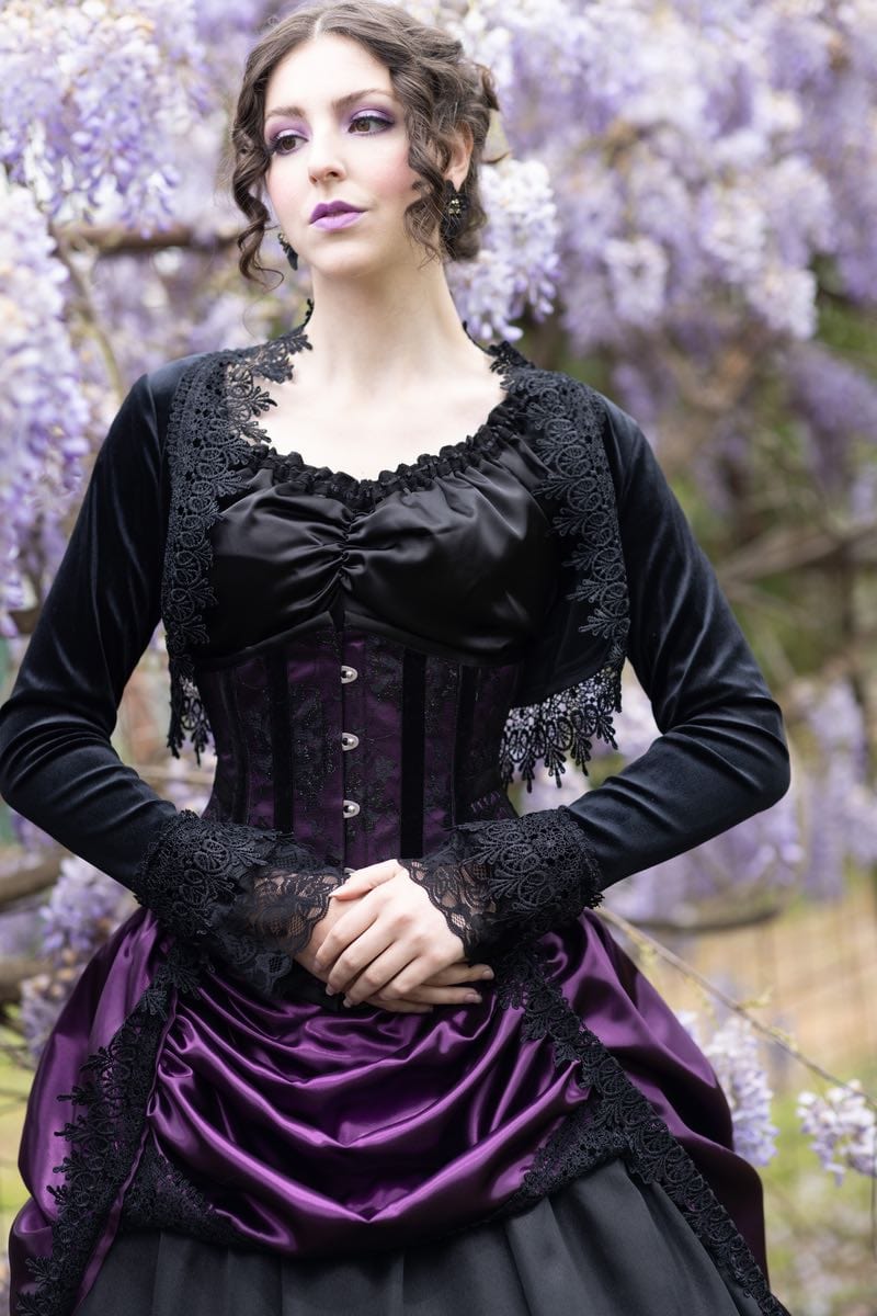 front view of the amethyst satin under bust corset and bustle gown on a gothic victorian model